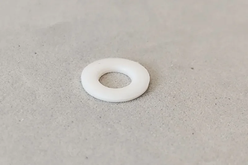 Achsdistanzen TEFLON (1) Distanzen Ø Innen 3,2 mm x 0,5 mm dick, f. 3 mm Slotcar Achsen und Wackler / T-Hülsen