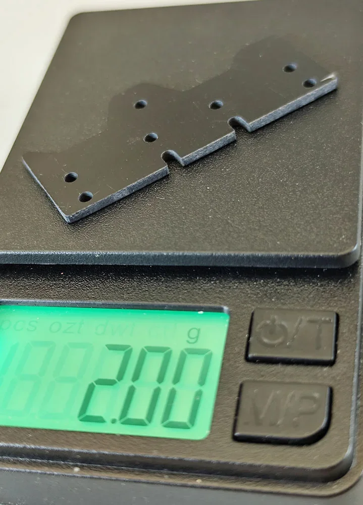 SCT-SF, GFK/CFK/ME, V3 Achs-Abstandshalter 8 Loch (länger, breiter), hinten, varibale Stärken und Materialien 0.01-2.0mm